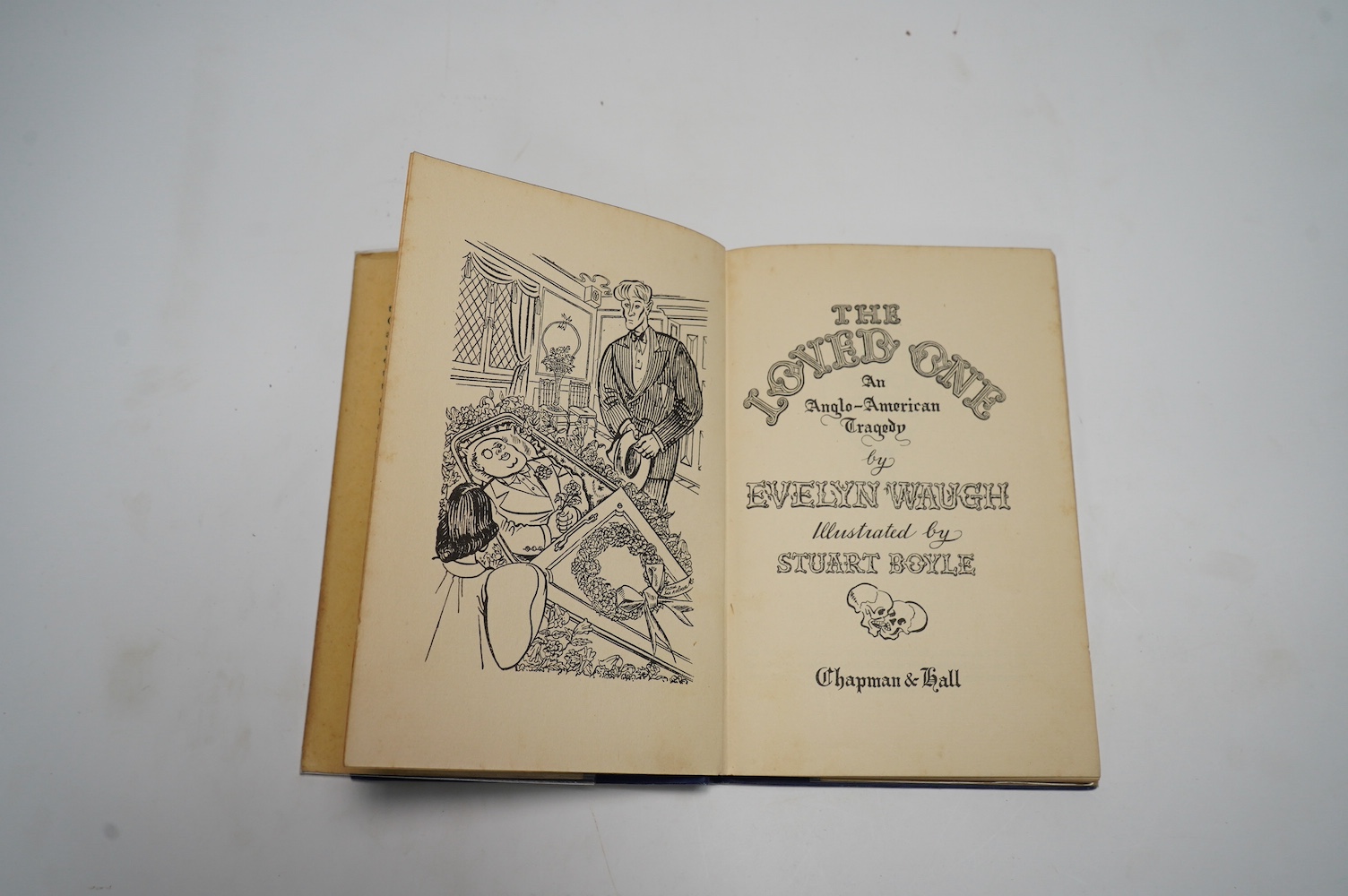 Waugh, Evelyn - The Loved One: An Anglo-American Tragedy, illustrated by Stuart Boyle, original blue cloth, spine lettered in gilt, in unclipped pictorial dust jacket, Chapman & Hall, London, [1948]